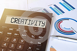 Word CREATIVITY on calculator. Business and finance concept