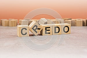 word Credo made with wood blocks. text is written in black letters, light background