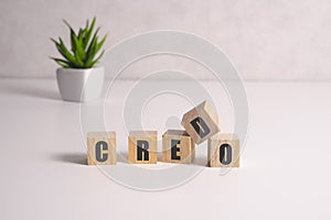 Word creed on white toy cubes, business concept