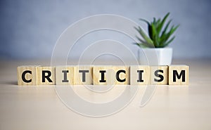 Word Criticism written with wooden blocks, business concept