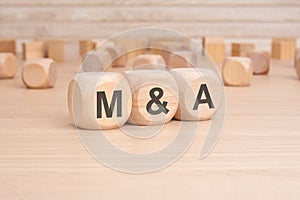 the word cubes formed M and A It's an abbreviation for Mergers and Acquisitions