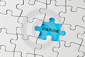 The word culture written on blue missing puzzle piece. Cultural island