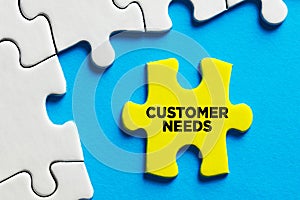 The word customer needs written on a puzzle piece