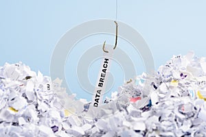 Word Data breach hooked on fishing hook pulled from pile of shredded documents