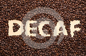 Word Decaf in coffee beans, top view
