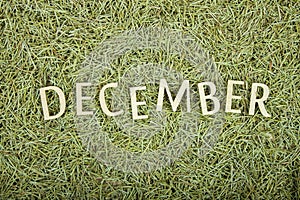 Word December corrugated saddle on Christmas background