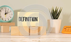 word DEFINITION on cement table for your desing, concept