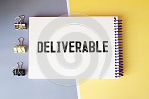 word Deliverable on notebook, concept