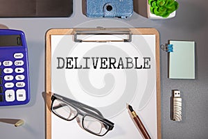 word Deliverable on notebook, concept