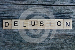 Word delusion made from  wooden letters