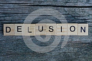 Word delusion made from  wooden letters photo