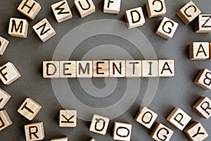 the word dementia wooden cubes with burnt letters