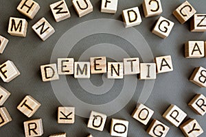the word dementia wooden cubes with burnt letters