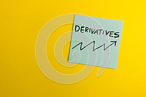 Word derivatives handwritten on sticky note