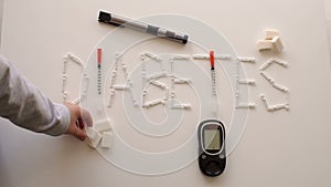 Word Diabetes is from the Lancet, insulin syringe, glucometer and a syringe pen.
