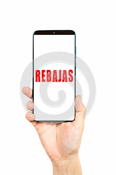 Word discount on a smartphone on a white background. Rebajas is discount in english photo