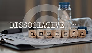Word DISSOCIATIVE AMNESIA composed of wooden dices photo