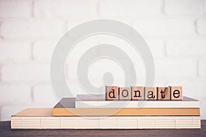 The word DONATE and blank space background, vintage