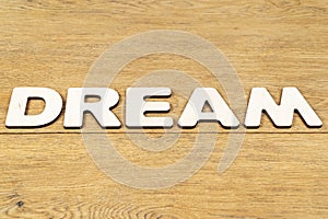 Word dream on a wooden table