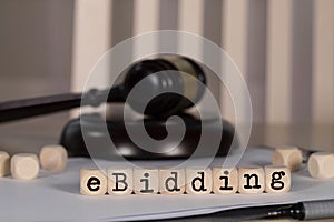 Word  eBIDDING  composed of wooden dices