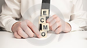 The word ecmo is written on wooden cubes . Medical concept