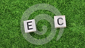 Word ECO composed on an artificial grass.