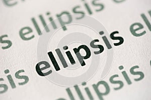 Word ellipsis printed on paper macro photo