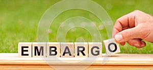 Word Embargo written with wooden blocks. Concept