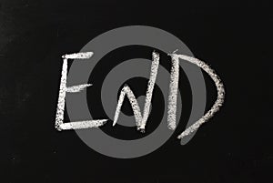 The word END written in white chalk on a black chalkboard