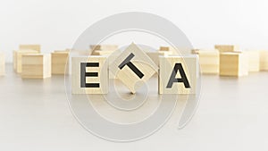 word ETA is made of wooden blocks on white background