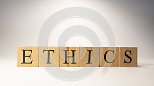 The word Ethics was created from wooden cubes. Rules and morals.