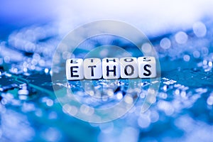 Word ETHOS formed by alphabet blocks on mother cryptocurrency