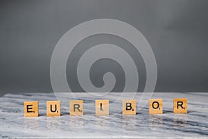 Word EURIBOR Is Written In Wooden Letters On Grey Background. Copy paste