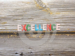 Word Excellence on wood