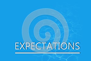 The word expectations on a blue background. the concept of expectations