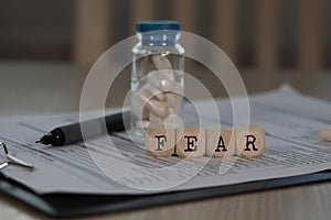 Word FEAR composed of wooden dices