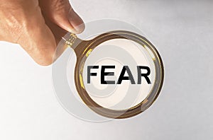 Word fear researched through magnifier or lens photo