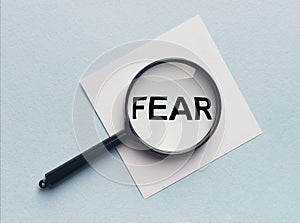 Word fear researched through magnifier or lens photo