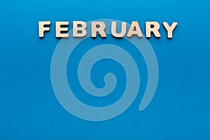 Word February on blue background