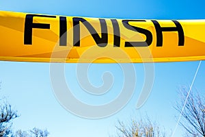Word Finish on a yellow banner against blue sky