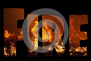 The word FIRE filled in with extreme close up of a wild grass fire in landscape format on black background.