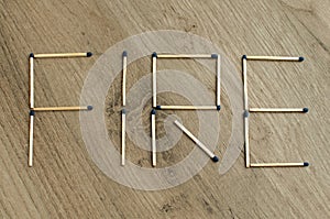 The word `fire` written by matchsticks