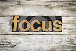 Focus Letterpress Word on Wooden Background photo