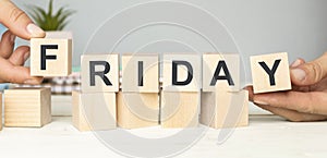 The word Friday on wooden cubes.