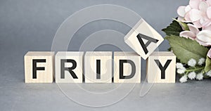 The word Friday on wooden cubes.