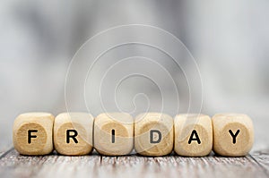 The word Friday on wooden cubes. Weekday concept
