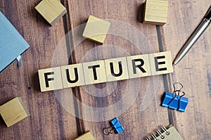word future made with wooden blocks and office supplies