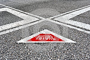 The word future written on asphalt road with direction arrows