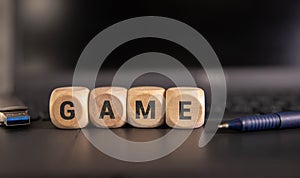 Word GAME made with wood building blocks. Top view.