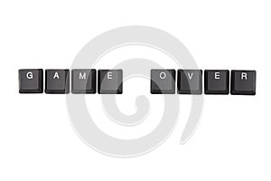 Word game over written on keyboard. Top view